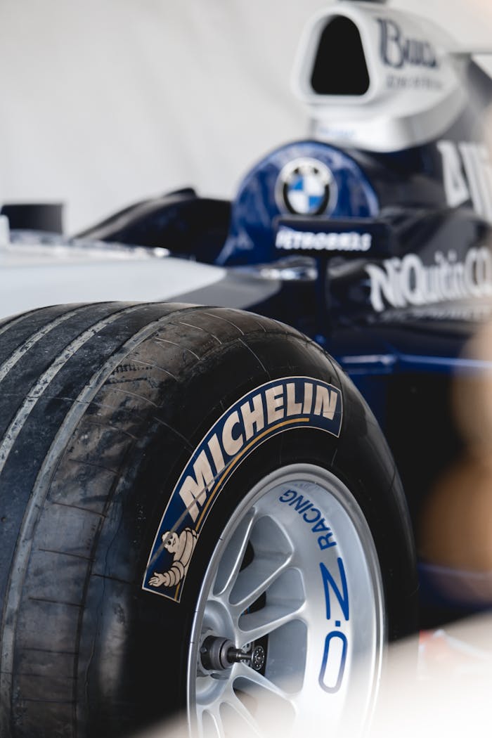 Detailed close-up of a Formula 1 car tire highlighting the Michelin branding, showcasing racing precision.