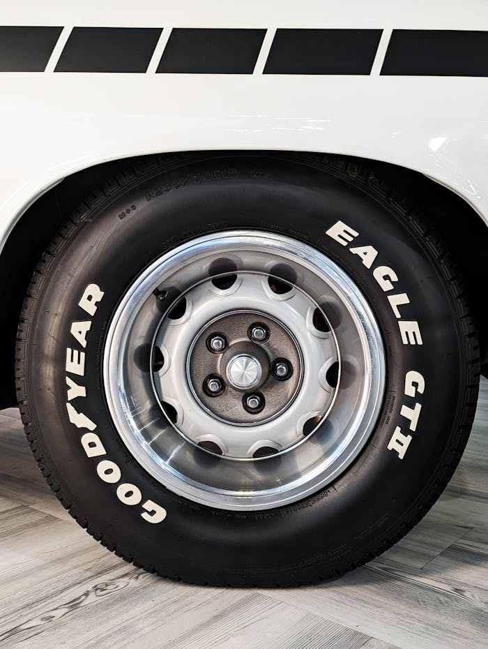 Close-up image of Goodyear Eagle GT II tire on a classic car wheel, outdoors in Halifax.